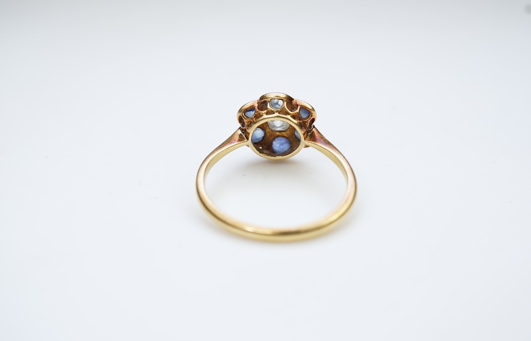 A sapphire and diamond cluster ring, early 20th century